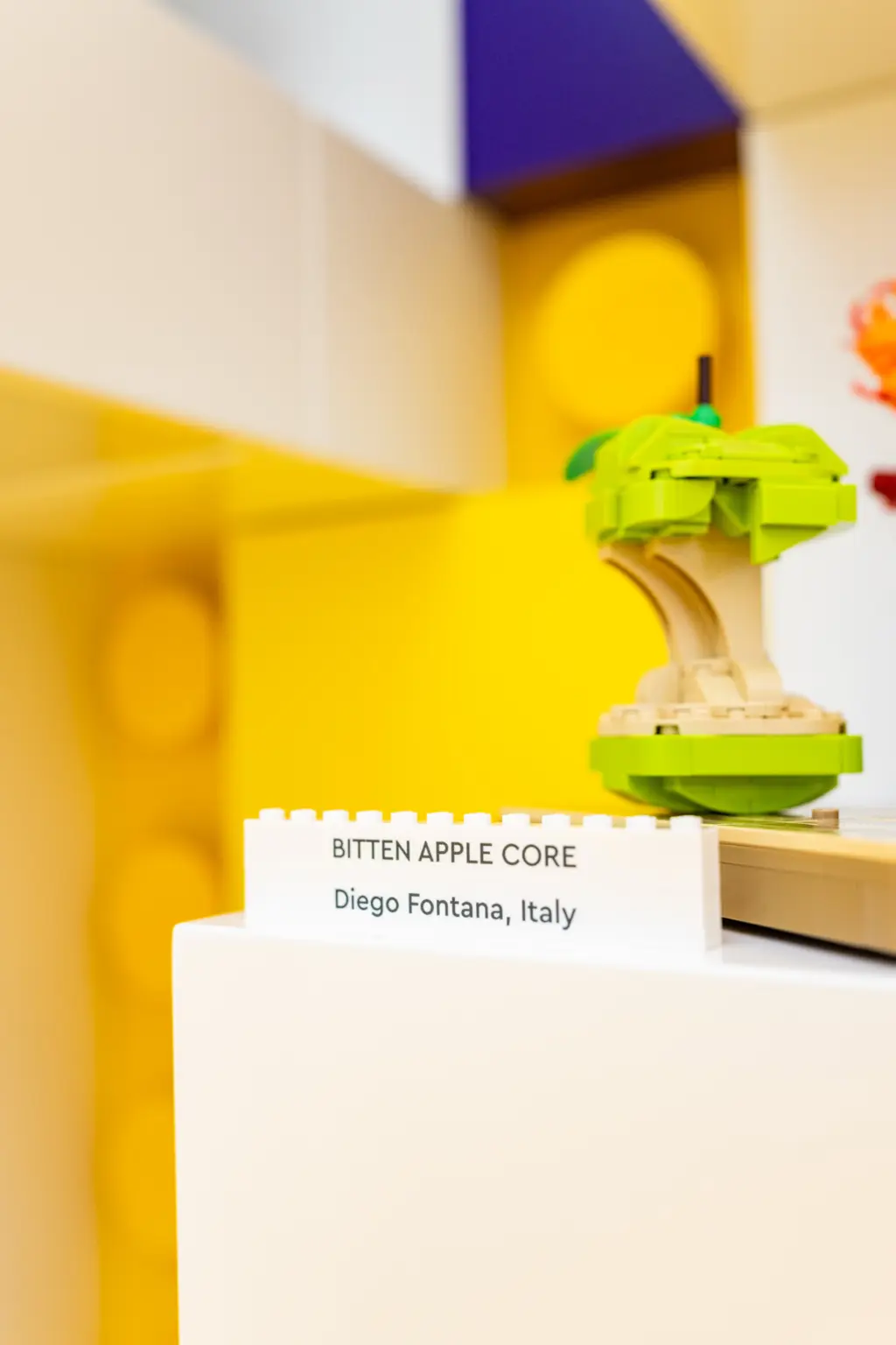 Diego Fontana's bitten apple core MOC exhibited at LEGO House